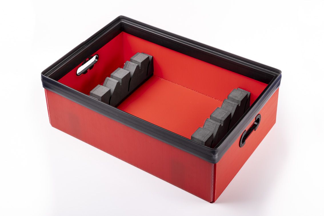 A detail shot of a red conTeyor Ecobox with black details