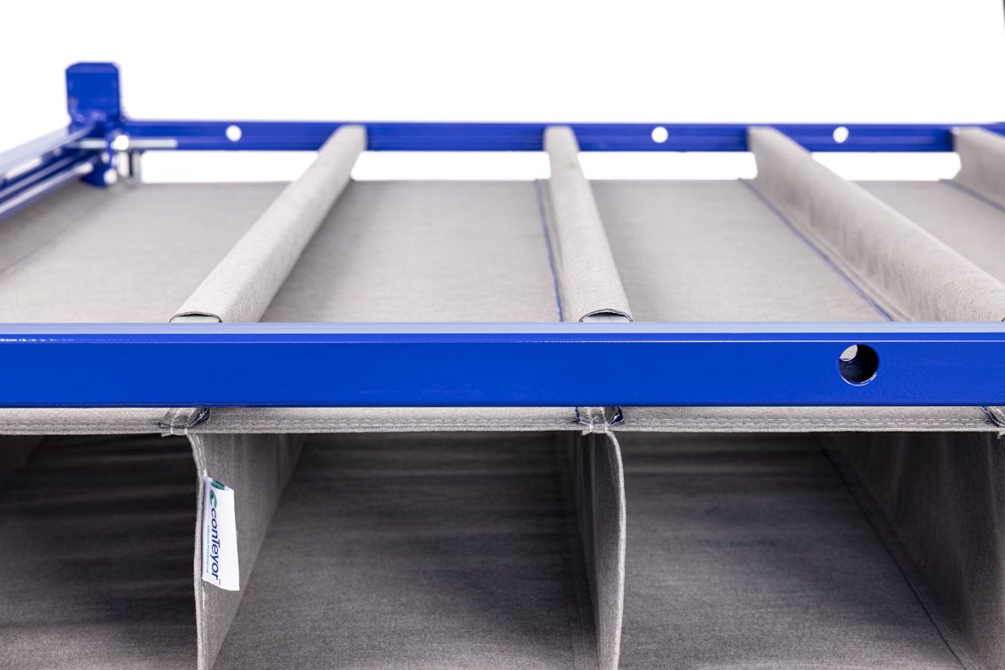 A close-up of a blue modular rack with textile inserts