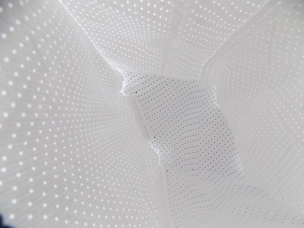 A close-up of custom white textile dunnage inserts