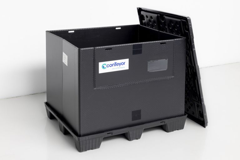 A black Ecopack Classic with the lid next to it